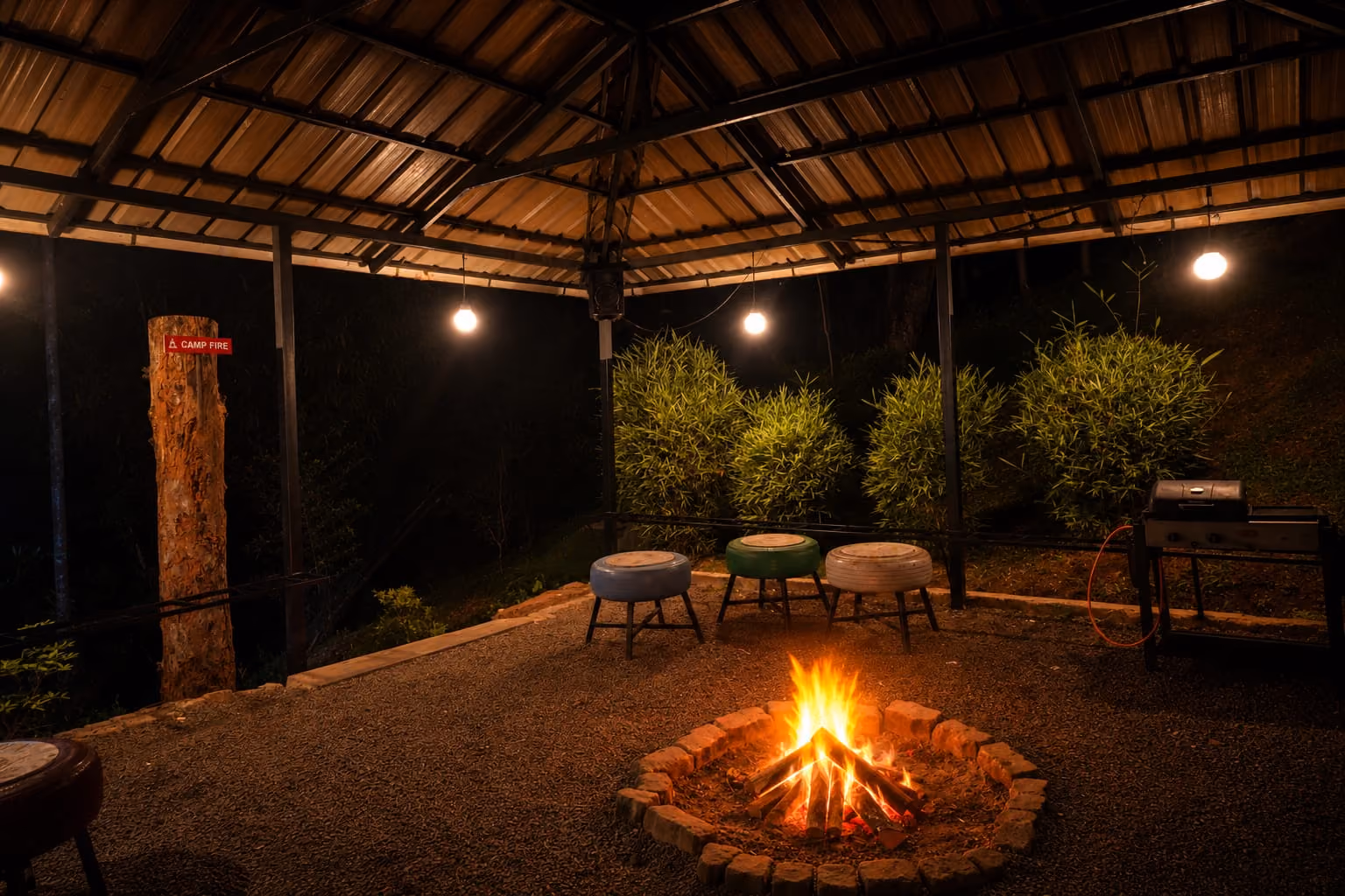A warm campfire of burning logs glowing in the evening