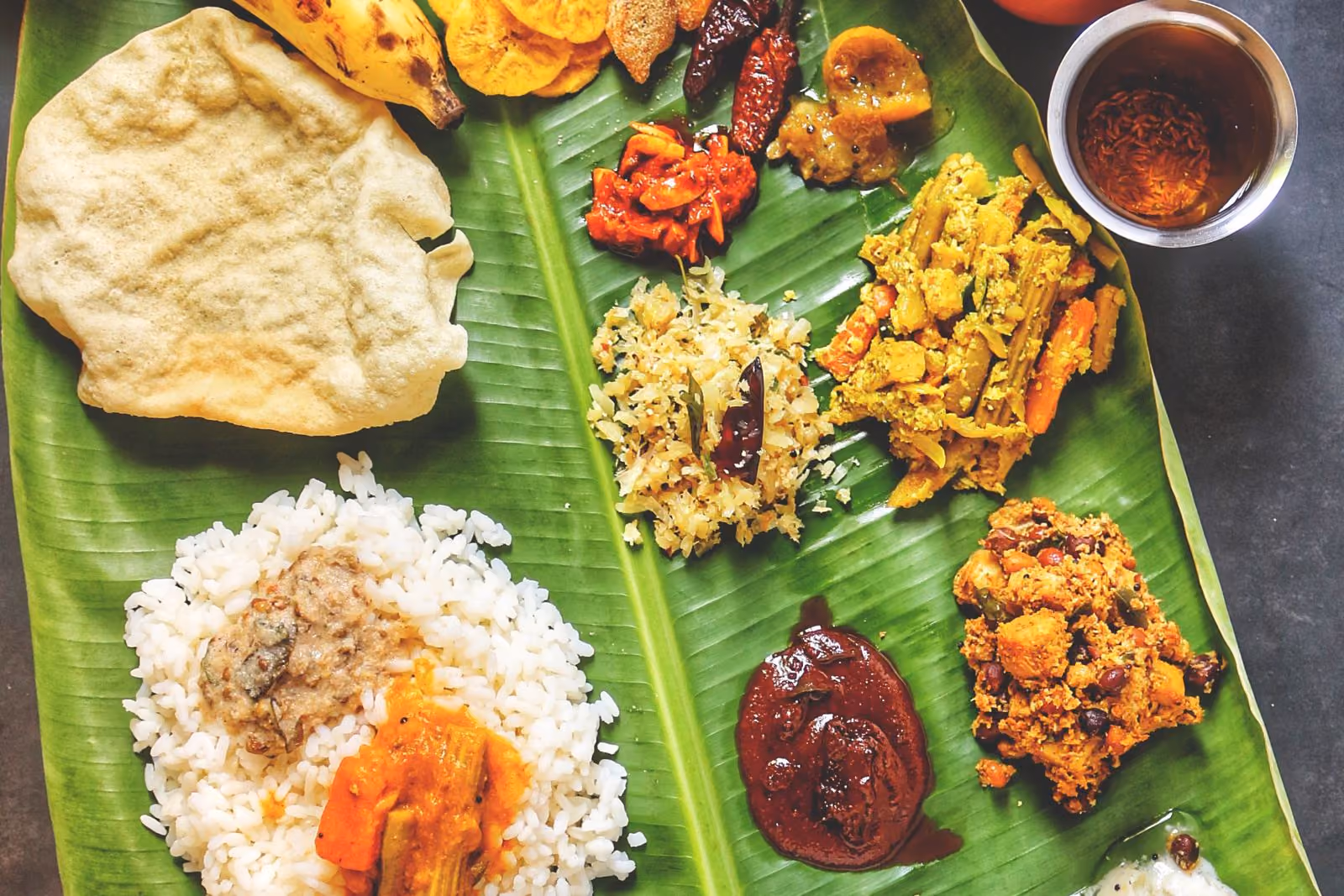 A traditional Kerala Sadhya served on a banana leaf