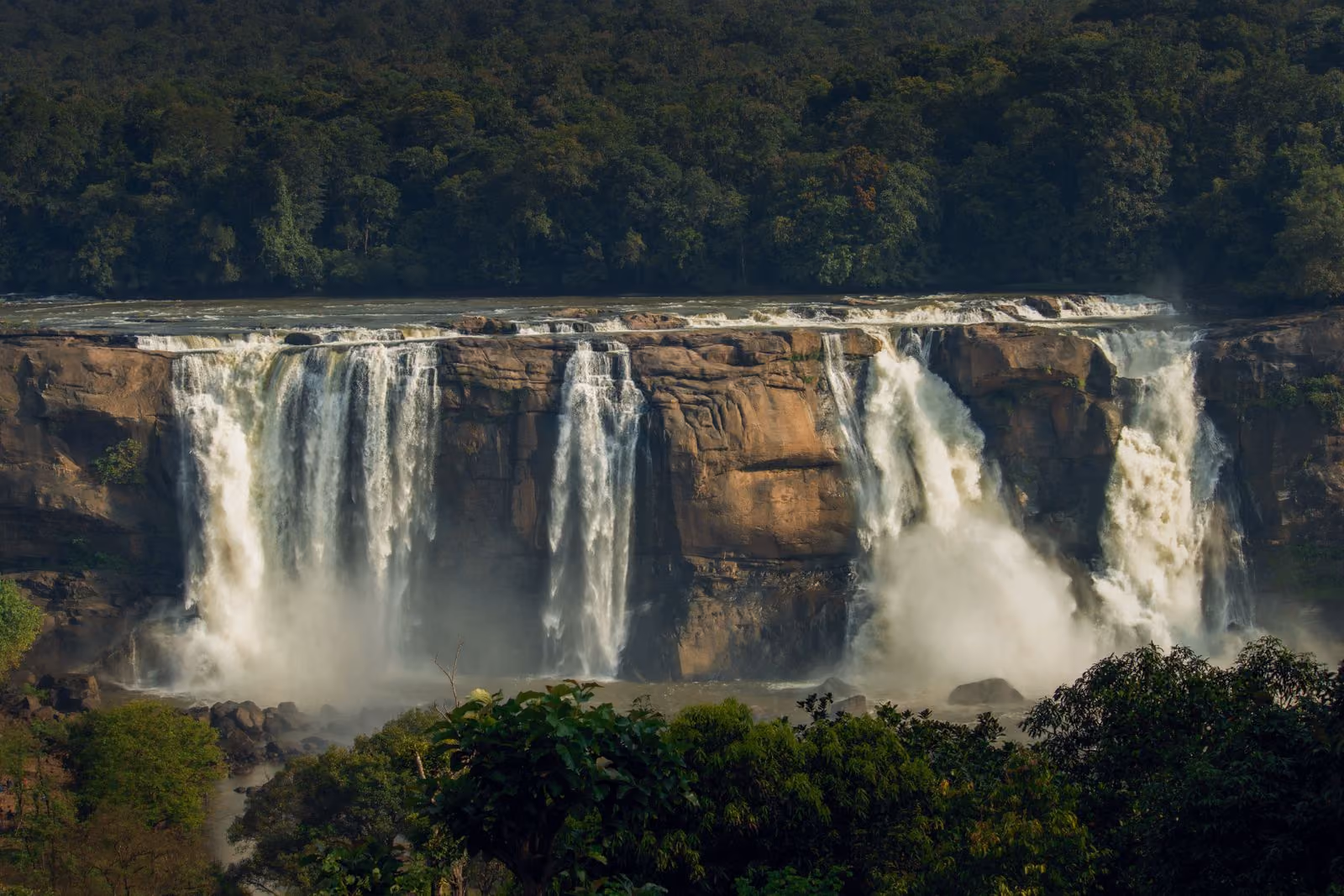 Athirappilly Falls cascading through the Kerala rainforest