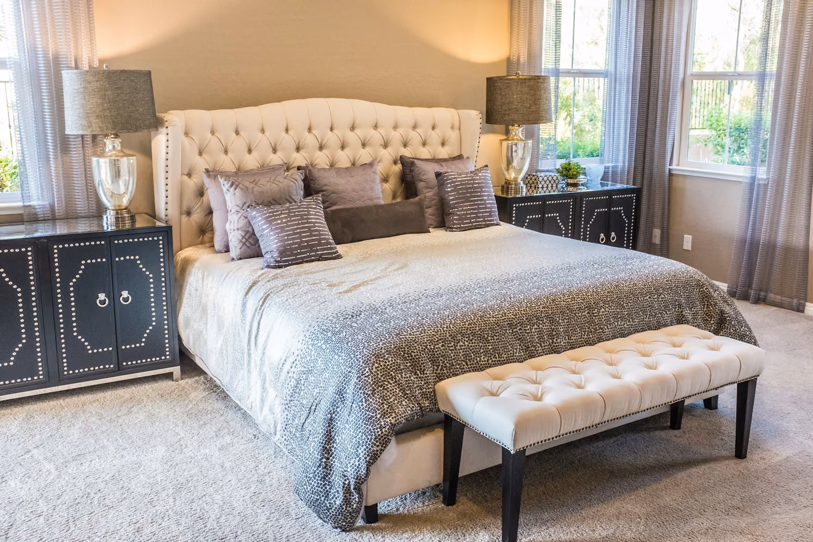 A cozy cottage bedroom with an elegant upholstered bed